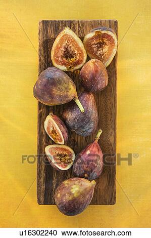 Figs on wood tray View Large Photo Image Stock Image - Figs on wood tray. Fotosearch