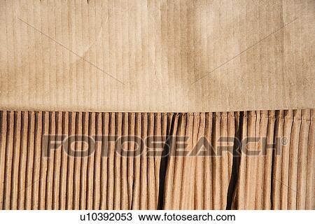 Stock Image - Frayed cardboard, studio shot. Fotosearch