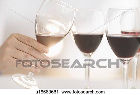Stock Image - Glasses with red wine. Fotosearch