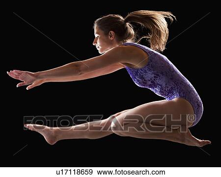 Gymnast jumping View Large Photo Image Stock Photo - Gymnast jumping. Fotosearch