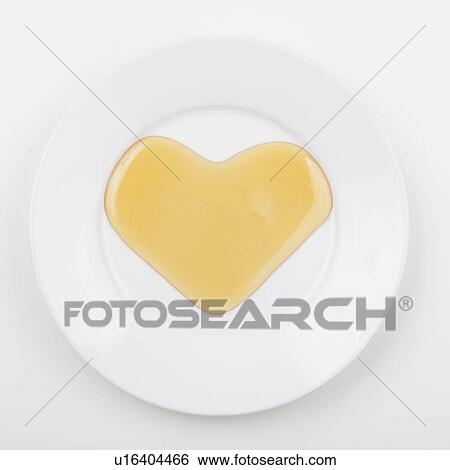 Honey shaped like heart View Large Photo Image Stock Photograph - Honey shaped like heart. Fotosearch