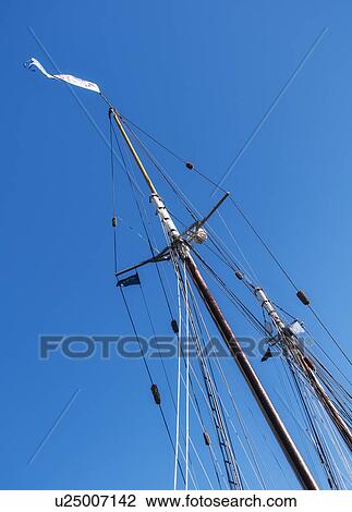 Low angle view of yacht mast against blue sky View Large Photo Image Stock Image - Low angle view of yacht mast against blue sky. Fotosearch