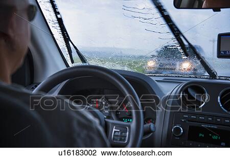 Man driving in rain View Large Photo Image Stock Image - Man driving in rain. Fotosearch