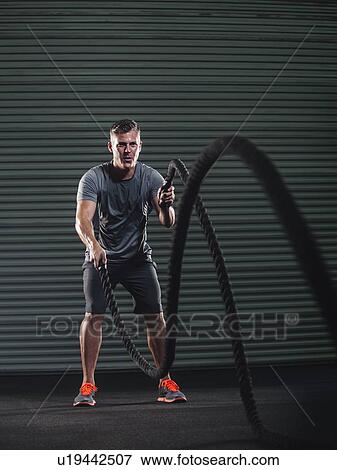 Mature man exercising with rope View Large Photo Image Stock Photo - Mature man exercising with rope. Fotosearch