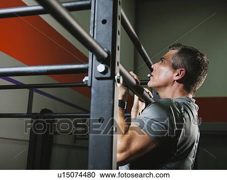 Mature man pulling him up View Large Photo Image Stock Image - Mature man pulling him up . Fotosearch