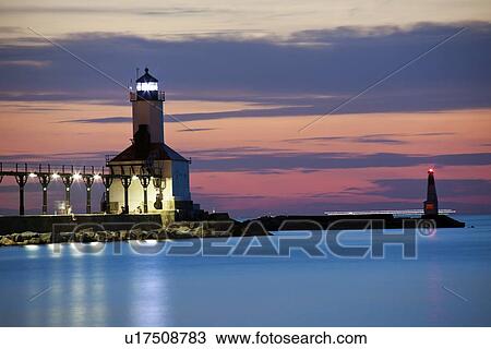 Michigan City Lighthouse at sunset. Chicago skyscrapers seen far in background. View Large Photo Image Stock Image - Michigan City Lighthouse at sunset. Chicago skyscrapers seen far in background.. Fotosearch