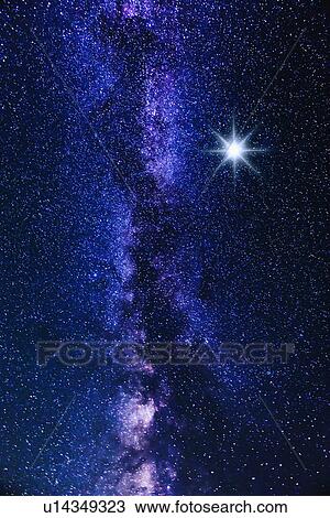 Stock Image - Milky way and big bright star. Fotosearch