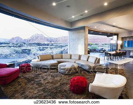 Stock Photograph - Modern living room interior facing terrace. Fotosearch