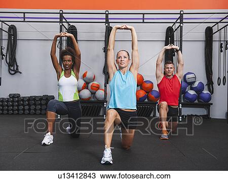 Multiracial group of two women doing aerobic in gym View Large Photo Image Stock Image - Multiracial group of two women doing aerobic in gym. Fotosearch