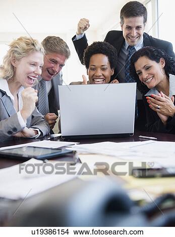 Office workers celebrating success View Large Photo Image Picture - Office workers celebrating success. Fotosearch