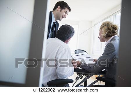 Office workers on meeting View Large Photo Image Stock Image - Office workers on meeting. Fotosearch