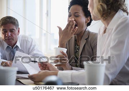 Stock Photo - Office workers on meeting. Fotosearch