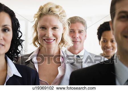 Office workers smiling View Large Photo Image Stock Image - Office workers smiling. Fotosearch