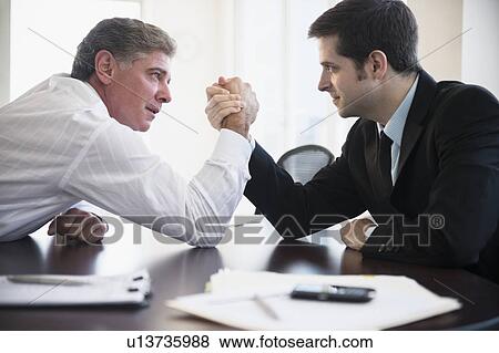 Office workers wrestling on desk View Large Photo Image Stock Photo - Office workers wrestling on desk. Fotosearch
