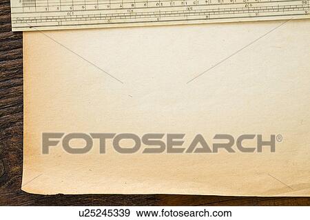 Stock Photo - Old brown paper with ruler, studio shot. Fotosearch