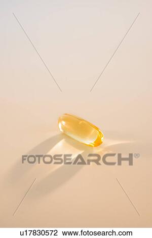 Stock Image - Omega fatty acid pill on white background, studio shot. Fotosearch
