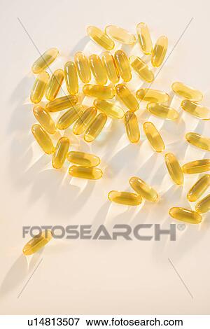 Stock Photo - Omega fatty acid pills on white background, studio shot. Fotosearch