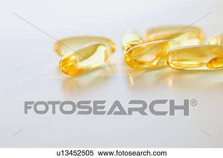 Stock Photography - Omega fatty acid pills on white background, studio shot. Fotosearch