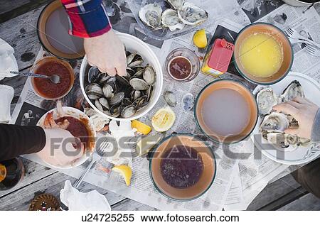 People eating oysters View Large Photo Image Stock Photography - People eating oysters. Fotosearch
