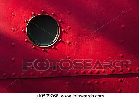 Porthole of red nautical vessel View Large Photo Image Stock Photograph - Porthole of red nautical vessel. Fotosearch