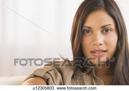 Stock Image - Portrait of attractive woman. Fotosearch
