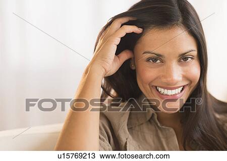 Stock Image - Portrait of attractive woman. Fotosearch