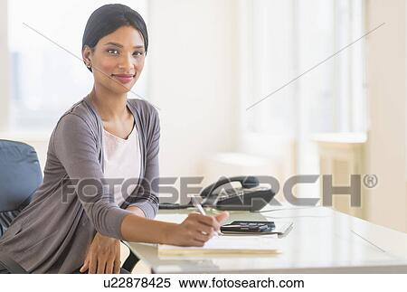Stock Photography - Portrait of businesswoman in office. Fotosearch