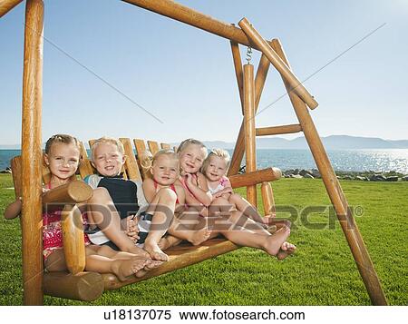 Portrait of children (2-3, 4-5) on swing View Large Photo Image Stock Photography - Portrait of children (2-3, 4-5) on swing. Fotosearch