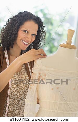 Portrait of clothes designer during work View Large Photo Image Stock Image - Portrait of clothes designer during work. Fotosearch
