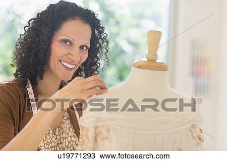Portrait of clothes designer during work View Large Photo Image Stock Image - Portrait of clothes designer during work. Fotosearch