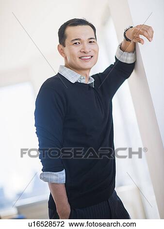 Portrait of confident mid adult man View Large Photo Image Stock Image - Portrait of confident mid adult man. Fotosearch