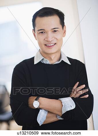 Portrait of confident mid adult man View Large Photo Image Stock Photo - Portrait of confident mid adult man. Fotosearch
