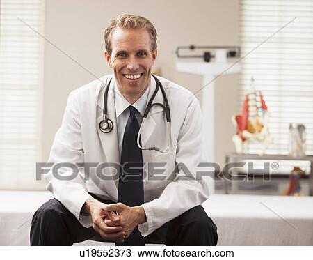 Portrait of doctor smiling View Large Photo Image Stock Image - Portrait of doctor smiling. Fotosearch
