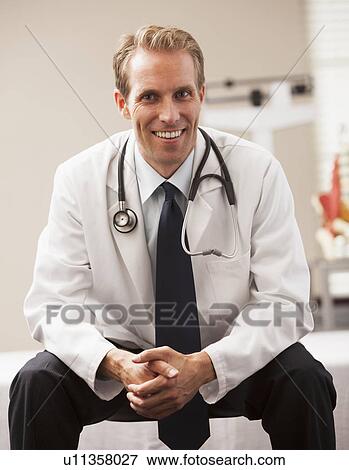 Portrait of doctor smiling View Large Photo Image Stock Photo - Portrait of doctor smiling. Fotosearch