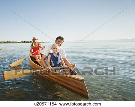 Portrait of family with son (4-5) canoe traveling View Large Photo Image Picture - Portrait of family with son (4-5) canoe traveling. Fotosearch