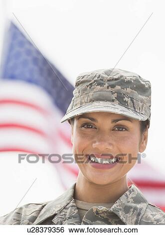 Portrait of female army soldier, American flag in background View Large Photo Image Stock Photograph - Portrait of female army soldier, American flag in background. Fotosearch