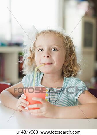 Portrait of girl drinking through straw View Large Photo Image Stock Image - Portrait of girl drinking through straw. Fotosearch