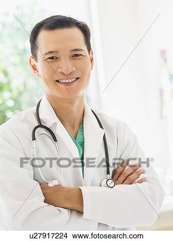 Portrait of happy mid adult doctor View Large Photo Image Picture - Portrait of happy mid adult doctor. Fotosearch