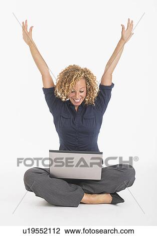 Portrait of happy young woman with laptop, studio shot View Large Photo Image Stock Image - Portrait of happy young woman with laptop, studio shot. Fotosearch