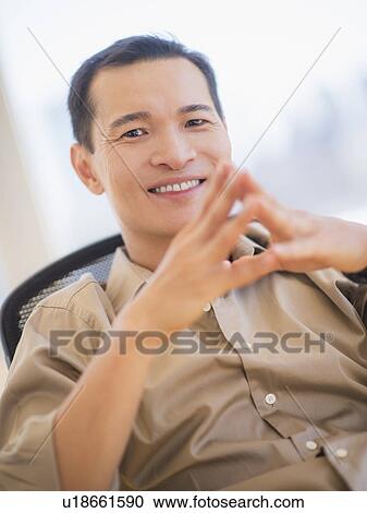 Portrait of mid adult man with hands clasped View Large Photo Image Stock Image - Portrait of mid adult man with hands clasped. Fotosearch