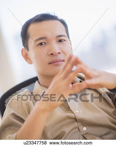 Portrait of mid adult man with hands clasped View Large Photo Image Stock Photo - Portrait of mid adult man with hands clasped. Fotosearch