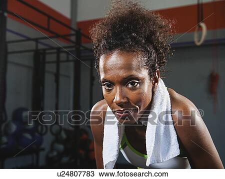 Portrait of mid-adult woman in gym View Large Photo Image Stock Image - Portrait of mid-adult woman in gym. Fotosearch