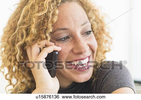 Portrait of smiling woman talking on mobile phone View Large Photo Image Stock Photograph - Portrait of smiling woman talking on mobile phone. Fotosearch