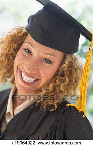 Portrait of smiling young woman in mortarboard View Large Photo Image Stock Image - Portrait of smiling young woman in mortarboard. Fotosearch