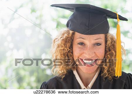 Portrait of smiling young woman in mortarboard View Large Photo Image Stock Photograph - Portrait of smiling young woman in mortarboard. Fotosearch