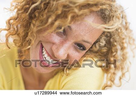 Picture - Portrait of smiling young woman. Fotosearch