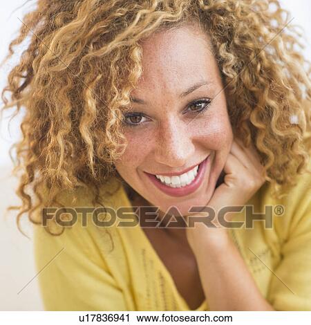 Portrait of smiling young woman View Large Photo Image Stock Image - Portrait of smiling young woman. Fotosearch