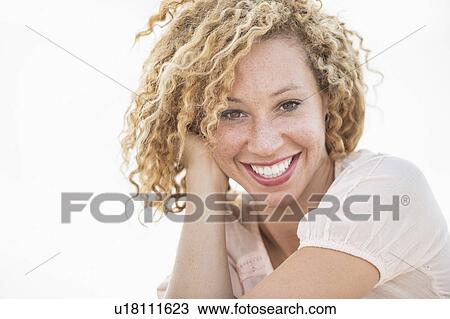 Stock Image - Portrait of smiling young woman. Fotosearch