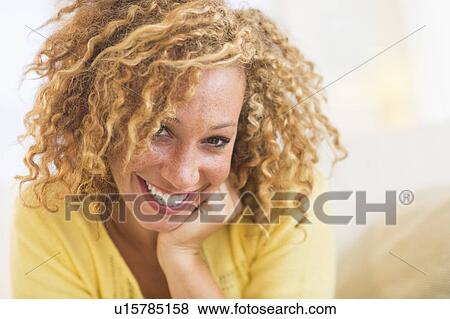 Portrait of smiling young woman View Large Photo Image Stock Photo - Portrait of smiling young woman. Fotosearch