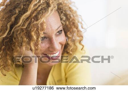Portrait of smiling young woman View Large Photo Image Stock Photograph - Portrait of smiling young woman. Fotosearch